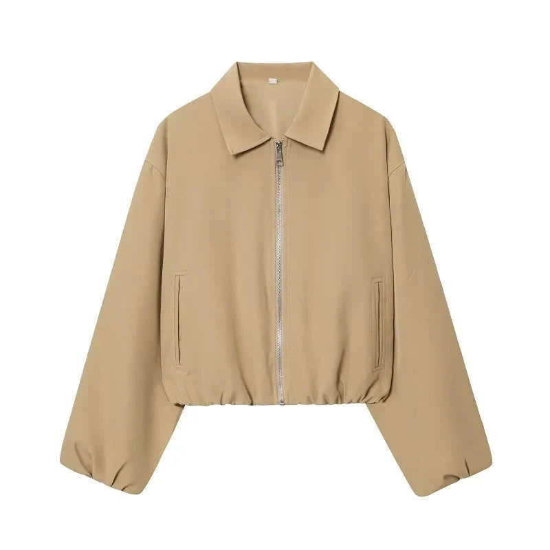 Cropped puffed bomber jacket in soft beige with a relaxed fit and zipper closure. Ideal for casual outfits.