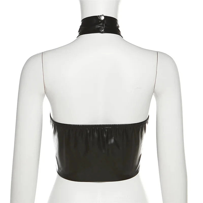 Sleek black halter crop top in PU leather with backless design and midriff-baring silhouette.