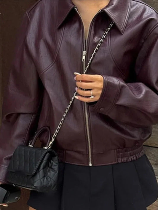 Belted retro faux leather jacket made of polyester with a stylish and windproof design.