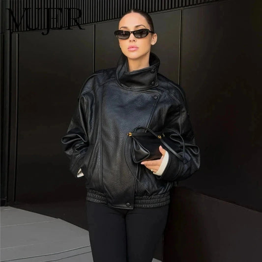 Chic black faux leather jacket with zipper closure and pockets, designed for a sleek silhouette and regular fit.