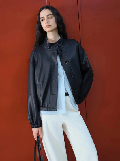 Brown stand collar leather jacket with single-breasted closure and loose fit, ideal for casual wear.