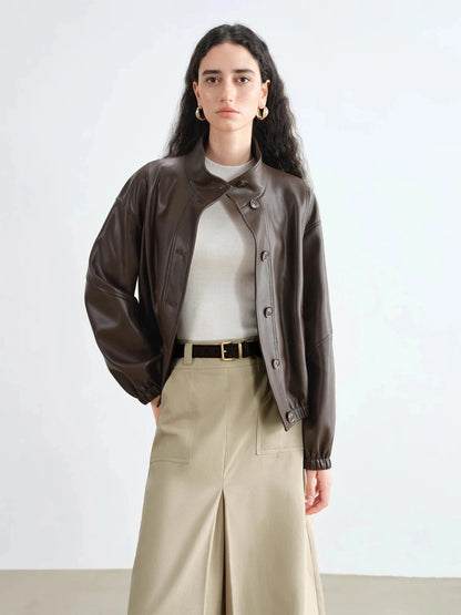 Dark brown stand collar leather jacket with single-breasted closure and loose fit, suitable for casual wear.