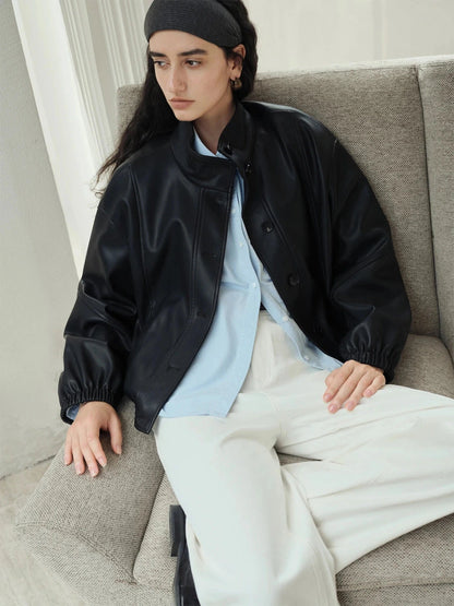 Brown stand collar leather jacket with single-breasted closure and loose fit, ideal for casual wear.