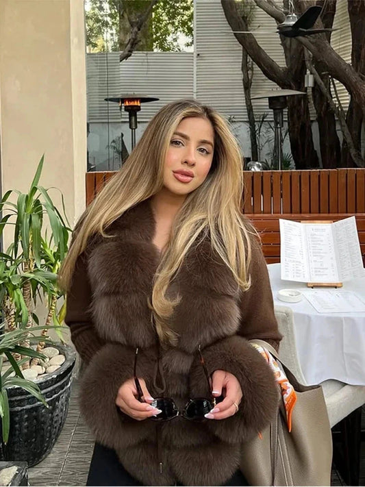 Chic knitted faux leather fur coat with modern patchwork design and open stitch closure. Regular fit for formal evenings.