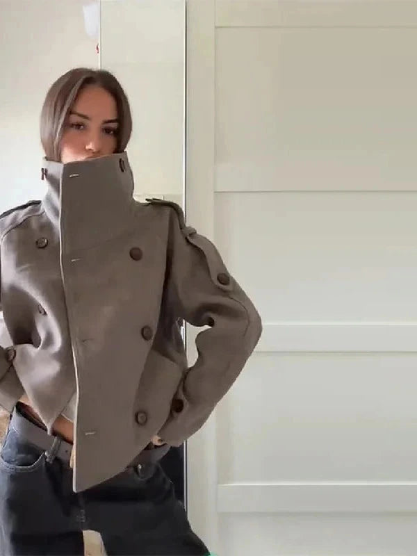 Chic stand collar wool blend coat with zipper closure and pockets, ideal for autumn and winter layering.