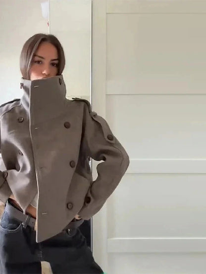 Chic stand collar wool blend coat with zipper closure and pockets, ideal for autumn and winter layering.