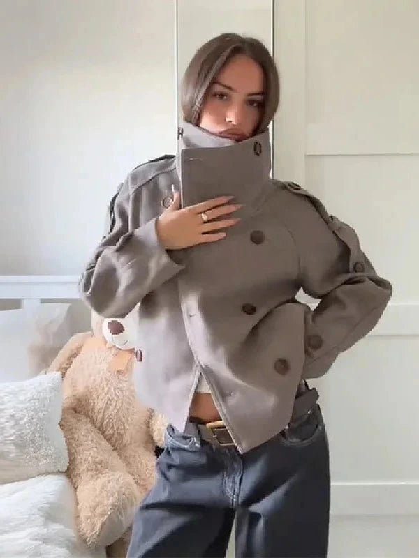 Chic stand collar wool blend coat with zipper closure and pockets, ideal for autumn and winter layering.