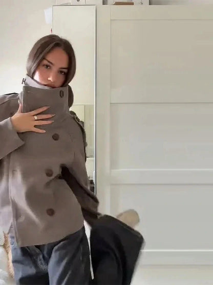 Chic stand collar wool blend coat with zipper closure and pockets, ideal for autumn and winter layering.