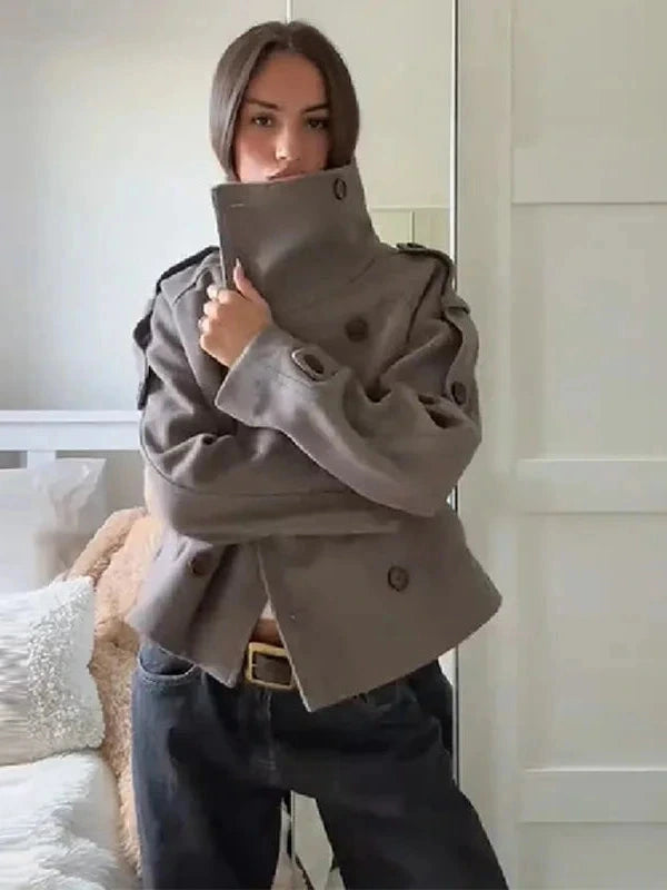 Chic stand collar wool blend coat with zipper closure and pockets, ideal for autumn and winter layering.