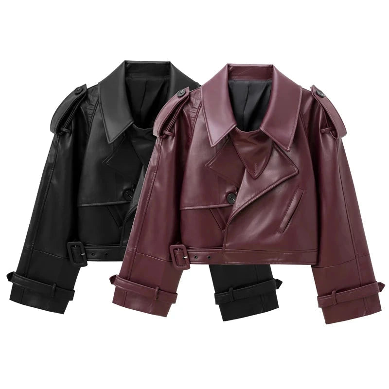 Cropped leather jacket with single button closure, designed for a loose fit and contemporary style. Ideal for layering.