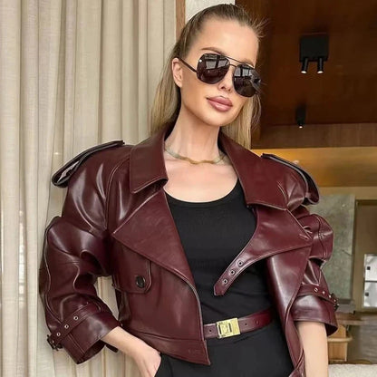 Cropped leather jacket with single button closure and loose fit, ideal for layering in casual autumn outings.