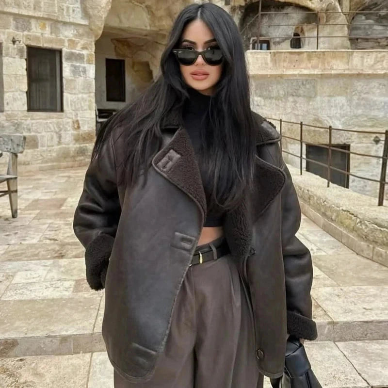 Chic faux leather fur crop jacket with button closure and pockets, featuring a loose fit for casual outings.