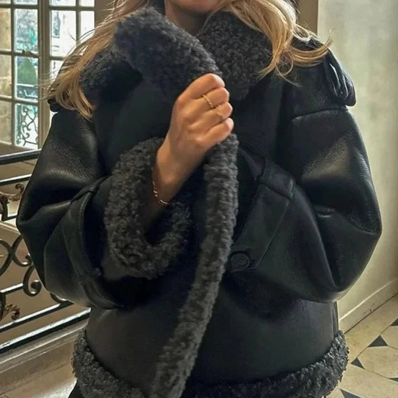 Luxe faux leather long jacket with fur trim, lapel collar, and belted waist in standard fit. Ideal for casual outings.