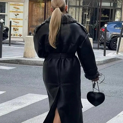 Luxe faux leather long jacket with fur trim, lapel collar, and belted waist in standard fit. Ideal for casual outings.