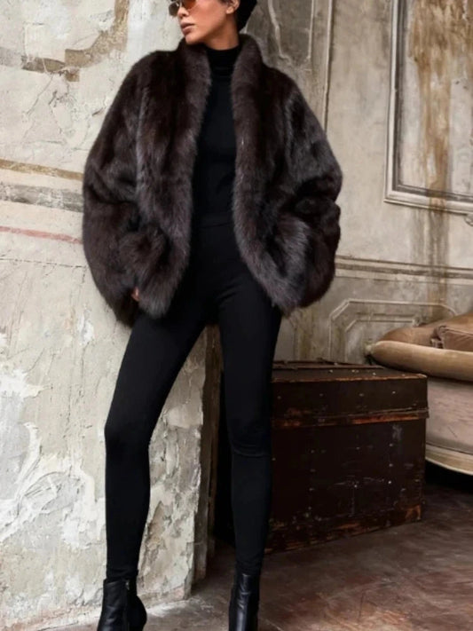 Chic faux leather fur mid-length coat with a turn-down collar and single-breasted closure, designed for warmth and style.