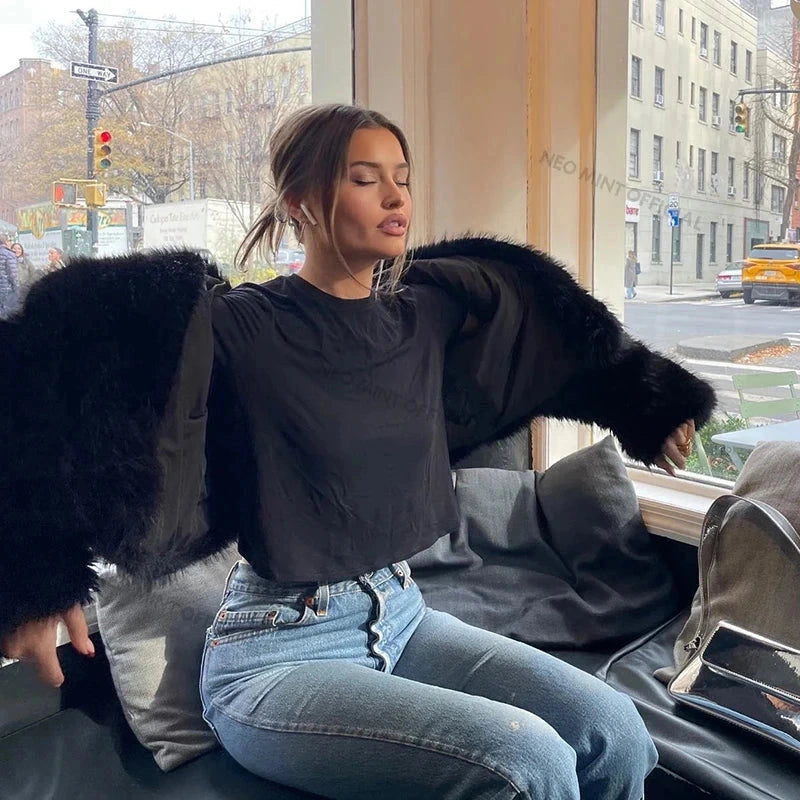 Chic faux leather coat with a luxurious shawl collar and wide-waisted, short length design. Perfect for autumn and winter.