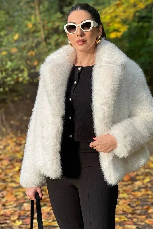 Chic faux leather fur short coat designed for warmth and casual outings with a thick and cozy feel. Regular fit outerwear.