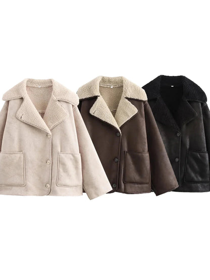 Chic vintage-inspired faux leather fur jacket with a loose fit, single-breasted design, and practical pockets.