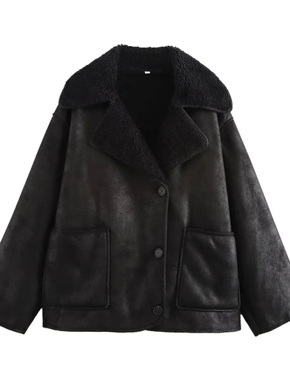 Chic vintage-inspired faux leather fur jacket in charcoal black with pockets and a loose fit.