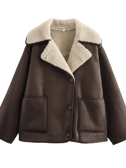 Dark brown vintage-inspired faux leather fur jacket with a loose fit, single-breasted design, and pockets.