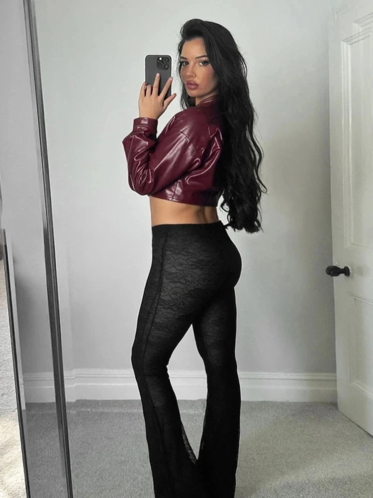 Chic faux leather crop jacket with a tailored silhouette and single button closure, suitable for casual or office wear.