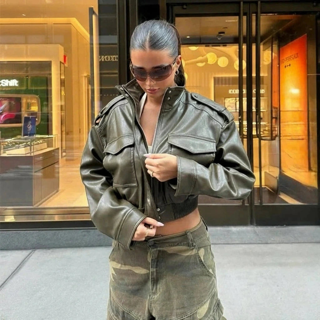 Chic cropped faux leather jacket with zipper closure and pockets, designed for a regular fit and sporty style.