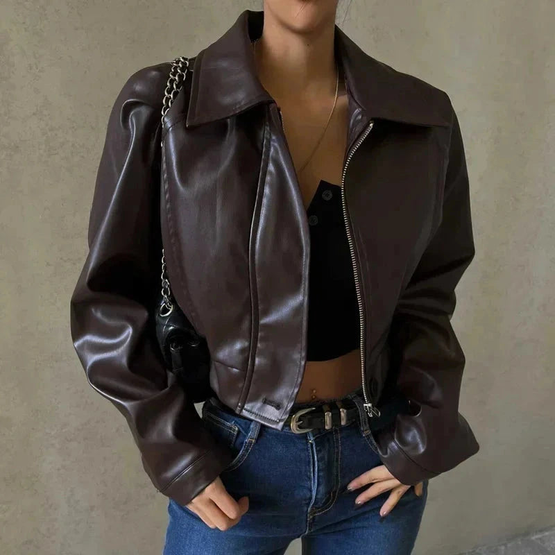 Chic oversized faux leather jacket with a turn-down collar and loose fit, ideal for autumn and winter layering.