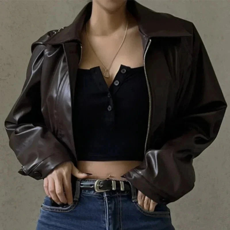 Chic oversized faux leather jacket with a turn-down collar and loose fit, ideal for autumn and winter layering.