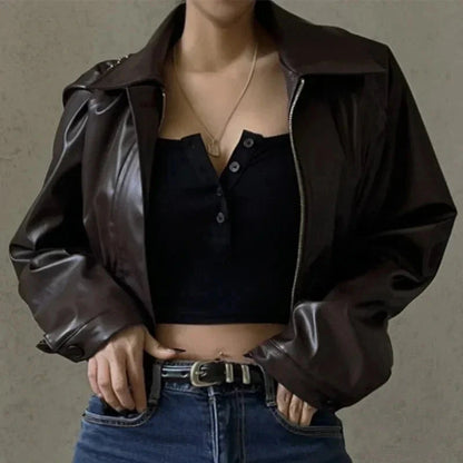 Chic oversized faux leather jacket with a turn-down collar and loose fit, ideal for autumn and winter layering.