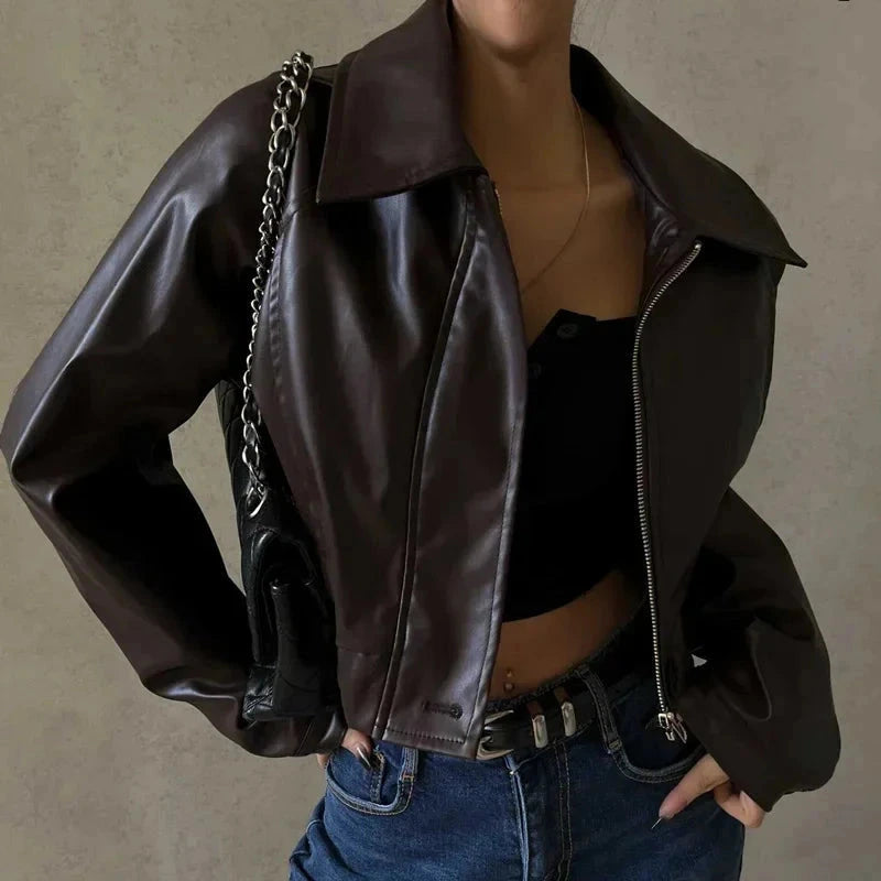 Chic oversized faux leather jacket with a turn-down collar and loose fit, ideal for autumn and winter layering.