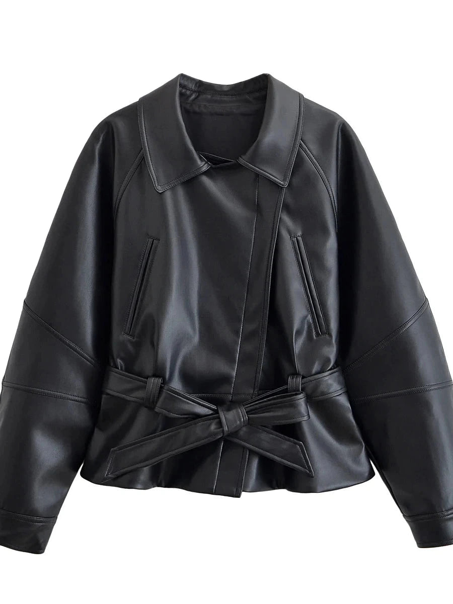 Chic faux leather trench coat in midnight black with a belted waist and zipper closure, perfect for autumn layering.