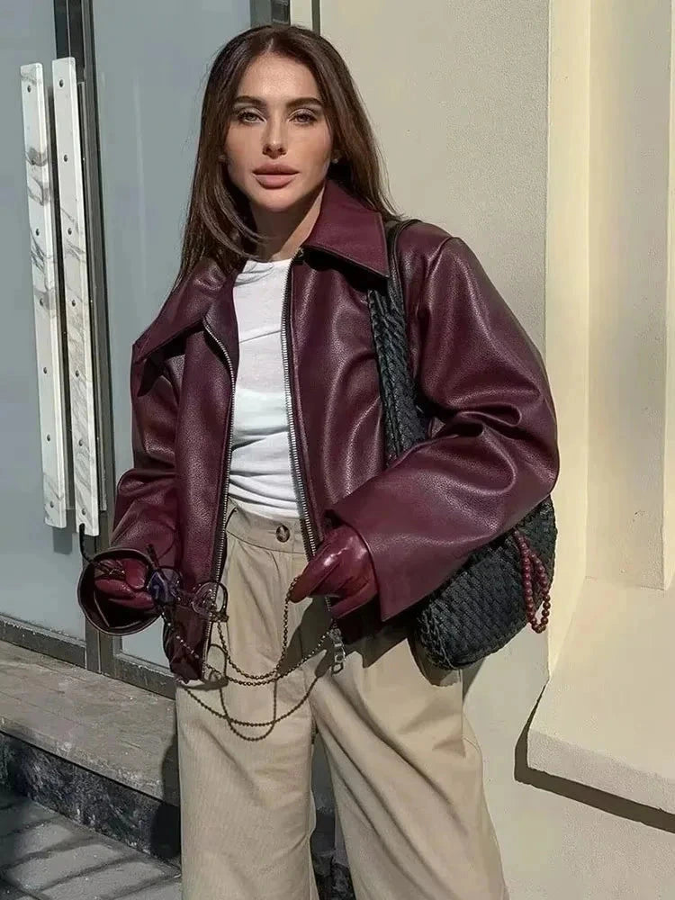 Chic faux leather zipper jacket with a sleek silhouette and regular fit, ideal for casual and urban wear.