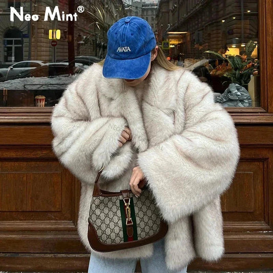 Gradient faux leather fur oversized coat with long sleeves and a modern gradient design for warmth and comfort.