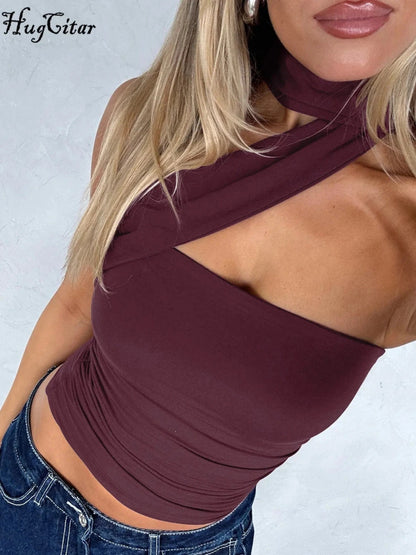 Halter ruched crop top with backless design and slight stretch for comfort. Ideal for casual outings and parties.