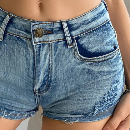 Elevated high-waisted denim shorts with button detail, crafted from a comfortable cotton blend for summer wear.