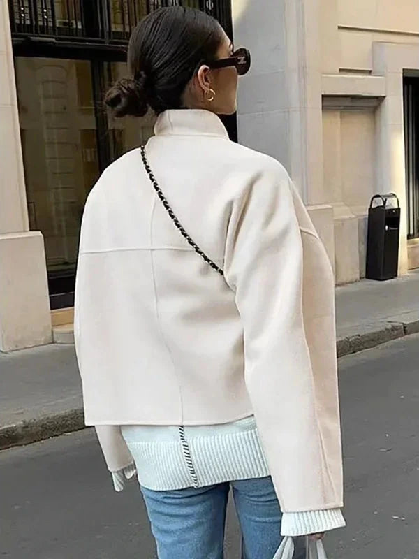 Contemporary loose fitting short jacket with open stitch closure, crafted from high-quality polyester.