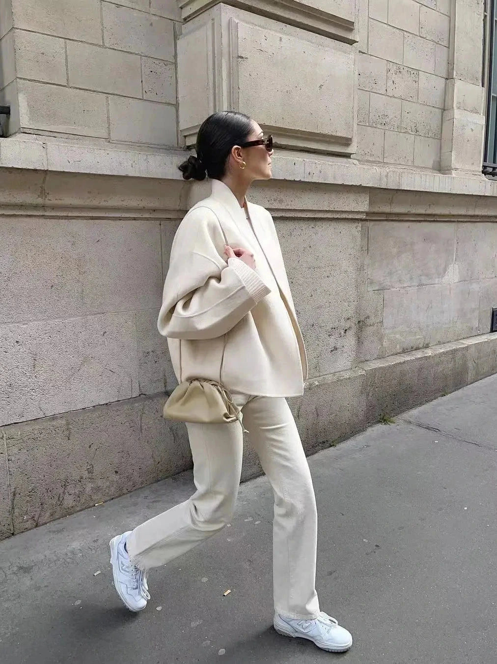 Contemporary loose fitting short jacket with open stitch closure, crafted from high-quality polyester.