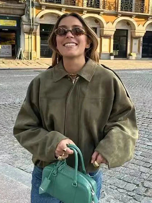 Chic oversized bomber jacket made from polyester with zipper closure and pockets, suitable for casual wear or parties.