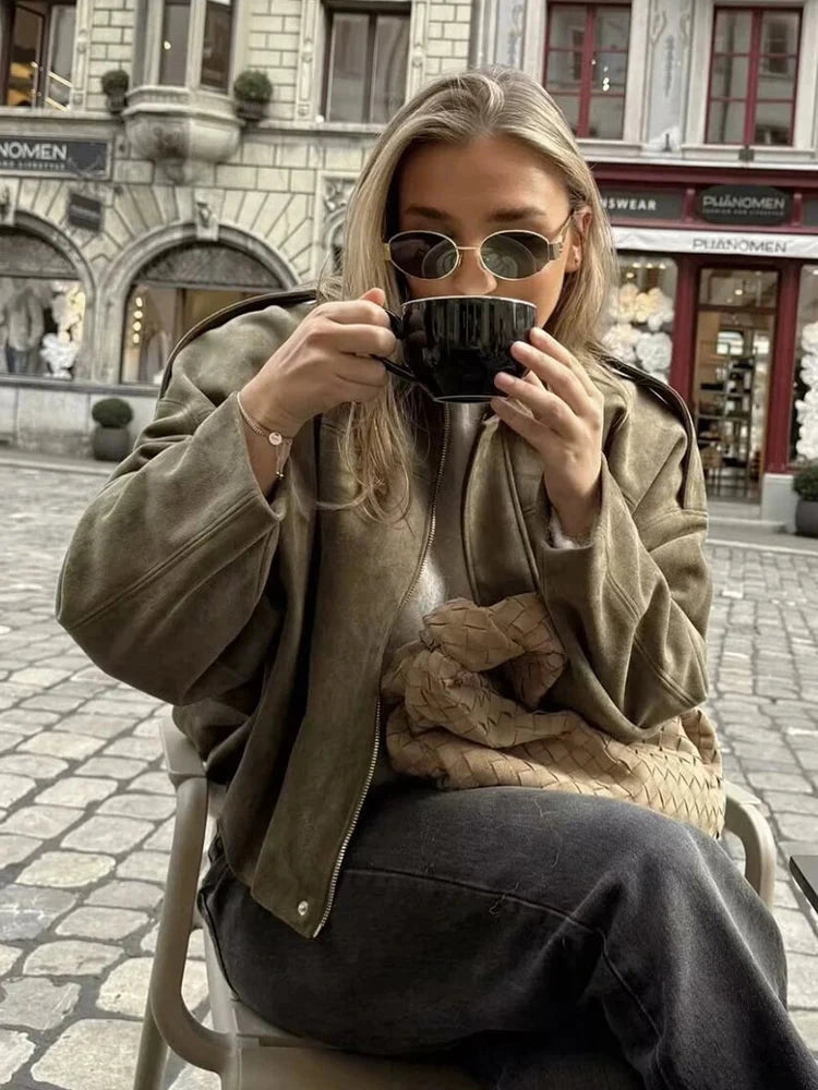 Chic oversized bomber jacket made from polyester with zipper closure and pockets, suitable for casual wear or parties.