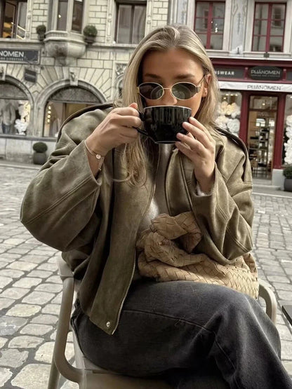 Chic oversized bomber jacket made from polyester with zipper closure and pockets, suitable for casual wear or parties.