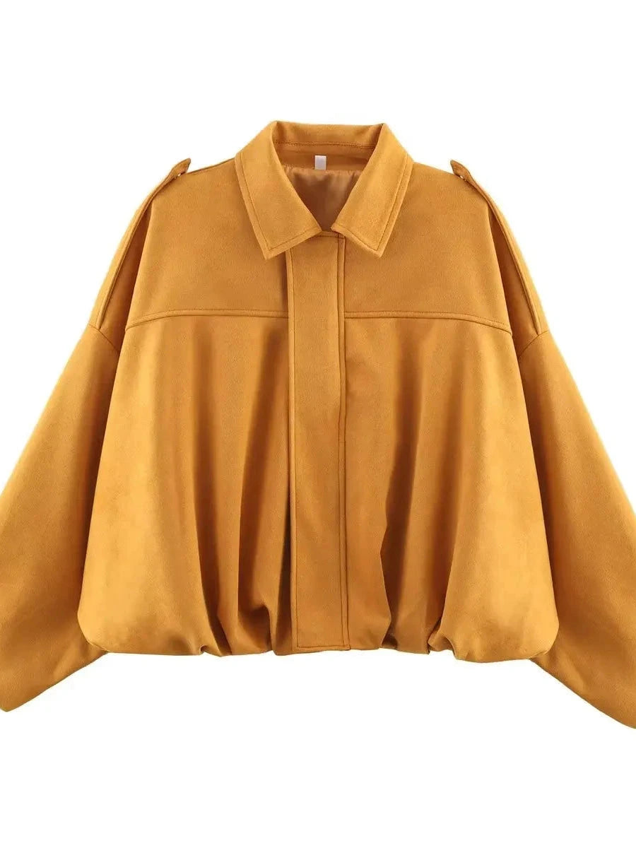 Chic oversized bomber jacket in mustard yellow with zipper closure and pockets, made from polyester material.
