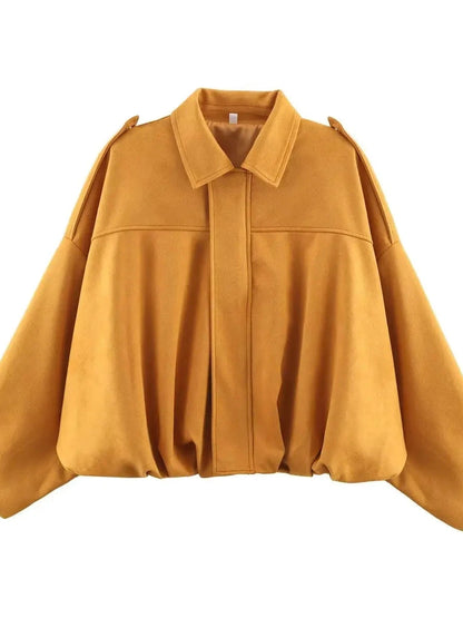 Chic oversized bomber jacket in mustard yellow with zipper closure and pockets, made from polyester material.