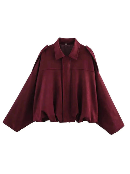 Burgundy red oversized bomber jacket with zipper closure and pockets, made from polyester material.
