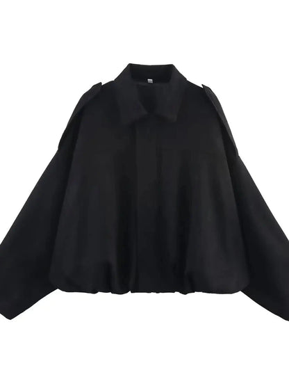 Chic oversized bomber jacket in midnight black with zipper closure and pockets, made from polyester material.