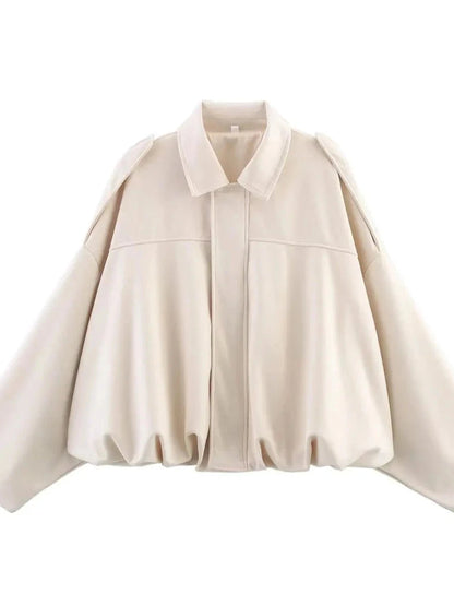 Cream beige oversized bomber jacket with zipper closure and pockets, made from polyester material.