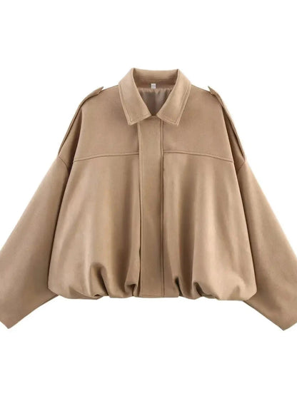Chic oversized bomber jacket in soft beige with zipper closure and pockets, made from polyester material.