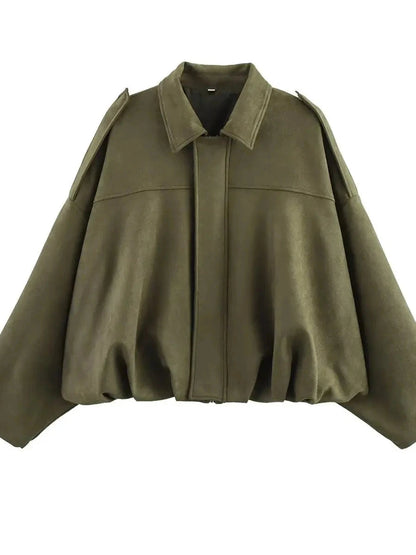 Olive green oversized bomber jacket with zipper closure and pockets, made from polyester material.