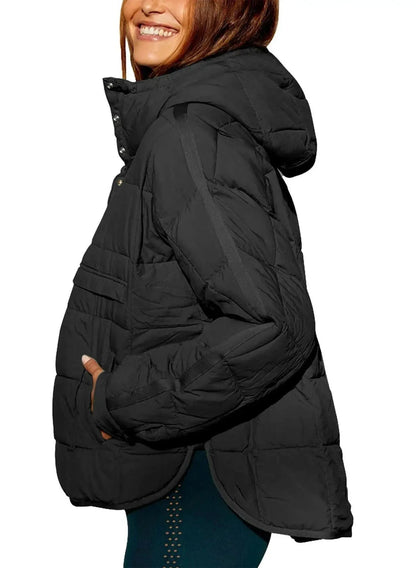 Cozy oversized puffer jacket with a hood, designed for casual layering and comfort. Made from lightweight polyester and spand