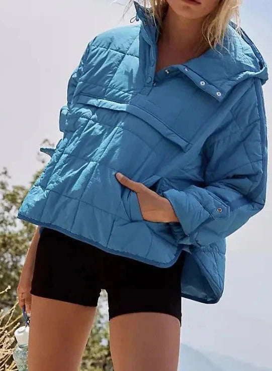Sky blue cozy oversized puffer jacket with a hood, designed for casual layering and comfort.