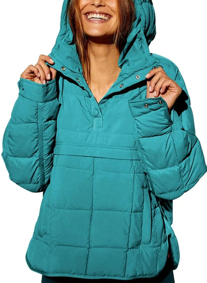 Teal blue cozy oversized puffer jacket with a hood, designed for casual layering and comfort.